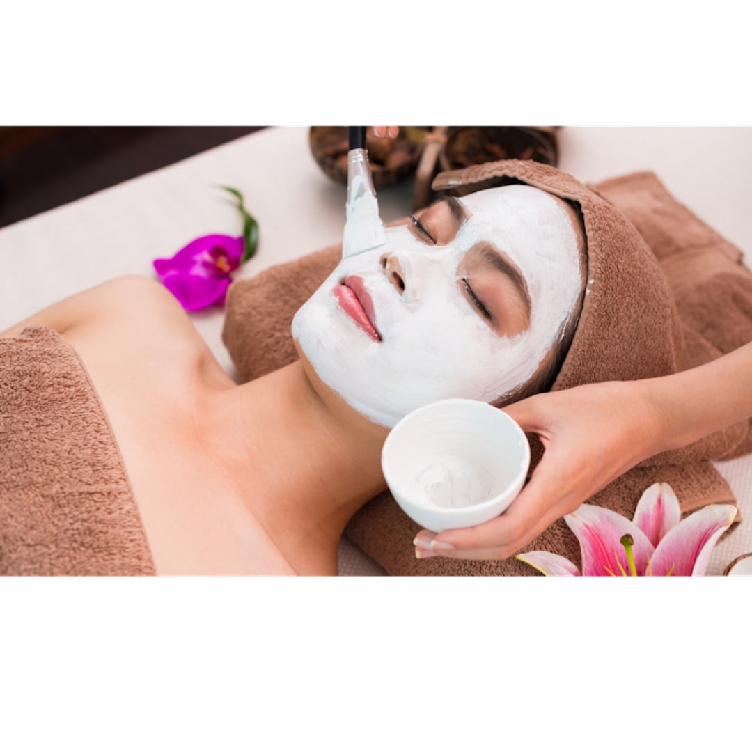female patient lying down receiving facial treatment from medical spa professional