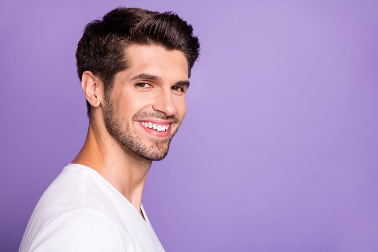A man with full, voluminous hair from scalp PRP treatment.